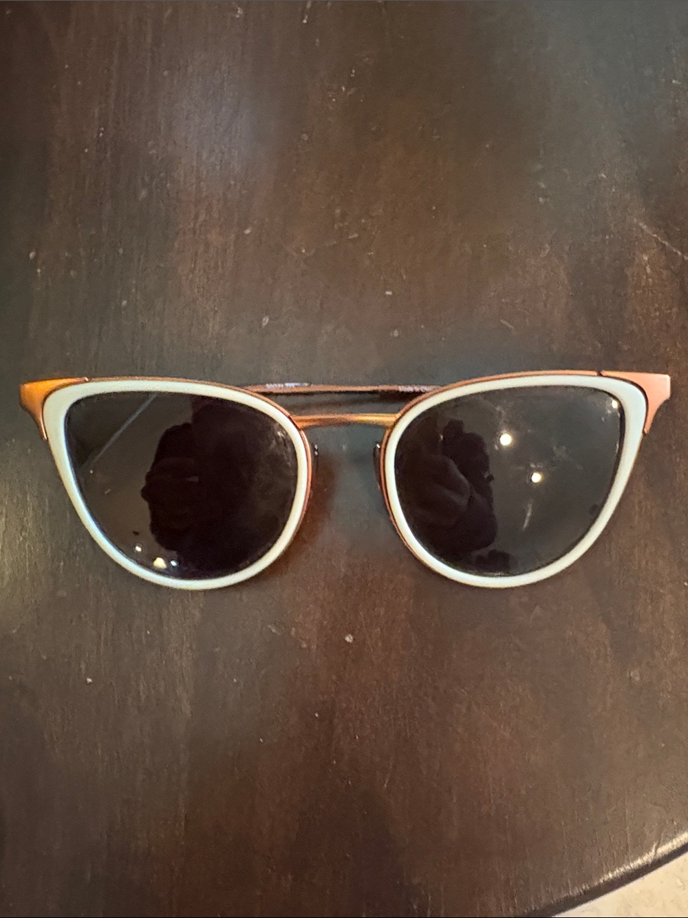 Women's sunski Sunglasses with amber frame and white trim on Black Lenses